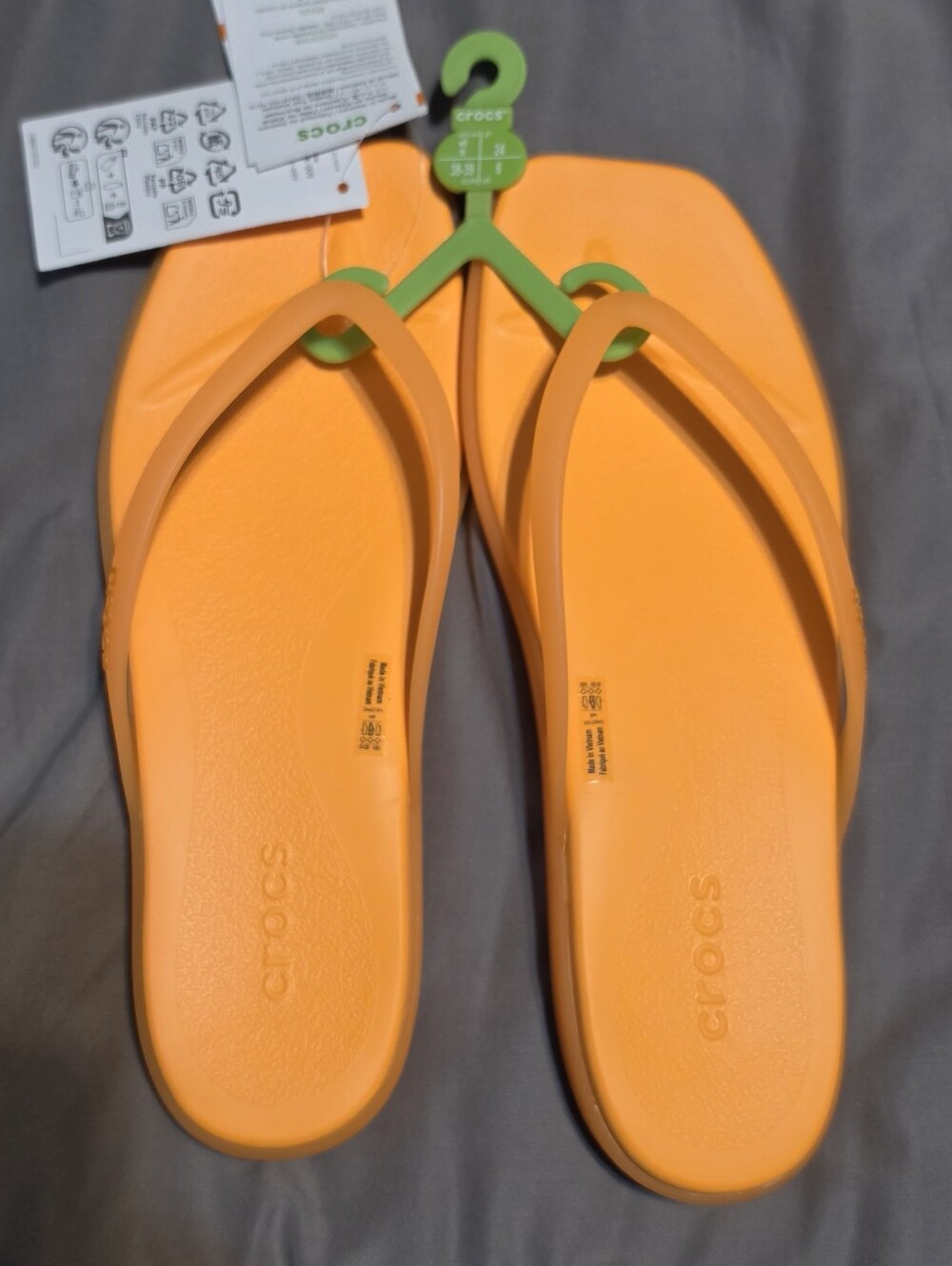 CROCS Women's Bright Orange Flip Flips